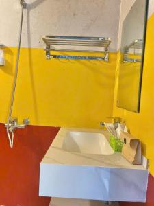 a bathroom with a sink and a mirror at Mường Sang Retreat in Mộc Châu +101 photos