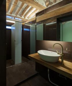 a bathroom with a white sink and a mirror at Side Hanok Residence in Seoul +54 photos