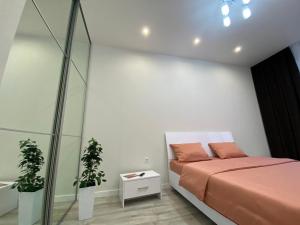 Postel nebo postele na pokoji v ubytování Елітні апартаменти в центрі міста ЖК Театральний,парковка