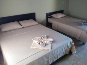 Postel nebo postele na pokoji v ubytování Syifa Homestay