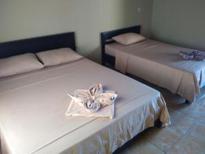 Postel nebo postele na pokoji v ubytování Syifa Homestay