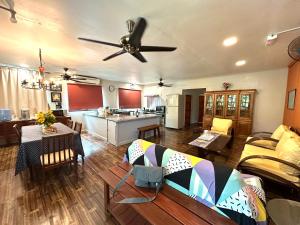 a large living room with a ceiling fan at Kampung B&B Homestay in Kampong Pepedonkiang