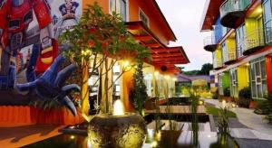 a building with a vase with plants in it at PPT Muar Hotel in Kampung Tanjung Agas