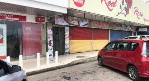 a red car parked in front of a store at SPOT ON 90077 Cherry's Lodge in Lahad Datu +32 photos