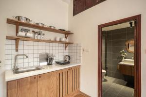 a bathroom with a sink and a shower at Urban Horizon Boutique Suites in Hanoi +70 photos