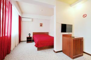 מיטה או מיטות בחדר ב-Hotel Nadezhda