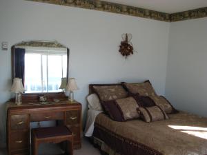 A bed or beds in a room at Cleft in the Rock Retreat