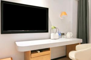 Μια τηλεόραση ή/και κέντρο ψυχαγωγίας στο Jin Yi Chain Hotel Agricultural University Branch