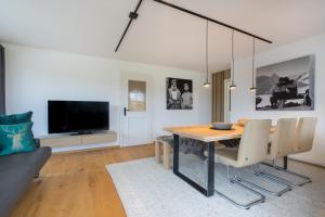 TV a/nebo společenská místnost v ubytování Ferienwohnungen Alpentraum - W 38