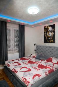 Ένα ή περισσότερα κρεβάτια σε δωμάτιο στο NelaLux