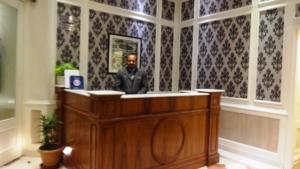 a statue of a man standing behind a podium at Hotel Bright in New Delhi