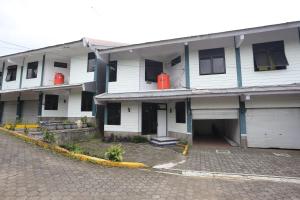 a large white building with a street in front of it at Villa Agape Near Puncak By ARBA in Pasakon 1