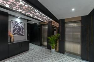 a hallway of a house with a potted plant at Kzar Park in Kolkata