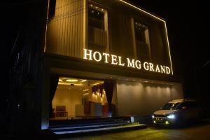 a hotel mg grand with a car parked in front of it at Hotel MG Grand in Rāmeswaram