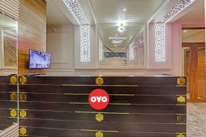 a row of stairs in a building with aoops sign on it at Hotel O Royal Regency Palace in Gorakhpur