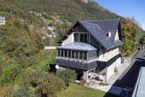 an aerial view of a house on a hill at Le Refuge des Isards - Chalet familial in Cauterets