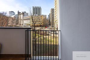 a balcony with a view of a city at Śliska Residence in Warsaw