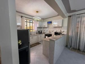 Η κουζίνα ή μικρή κουζίνα στο B106 -Aries Luxe Suites 1 Bedroom