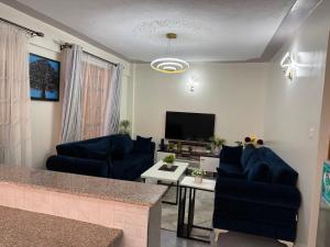 Μια τηλεόραση ή/και κέντρο ψυχαγωγίας στο B106 -Aries Luxe Suites 1 Bedroom