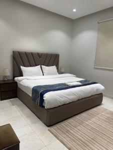 Postel nebo postele na pokoji v ubytování New Time Apartments