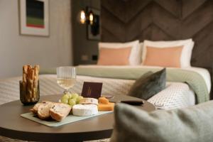a tray of food on a table in a hotel room at The Wellington Glasgow by Adina in Glasgow