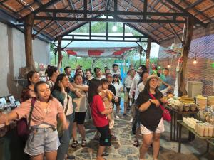 a large group of people standing in a crowd at Tổ Homestay in Tân Phú
