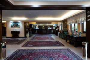 a large room with a large rug on the floor at Baia Di Ulisse Wellness & Spa in San Leone