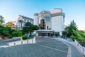 a building with a street in front of it at SİDE SUN in Manavgat