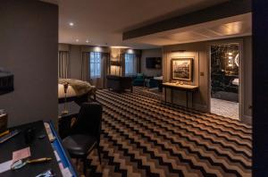 a hotel room with a living room with a hotel room at Hotel Gotham Newcastle in Newcastle upon Tyne