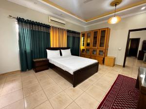 Postel nebo postele na pokoji v ubytování Mashal Guest House Islamabad + 16 fotografií