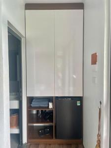 a room with a closet with a large glass wall at Mường Dy Retreat 2 in Ba Vì