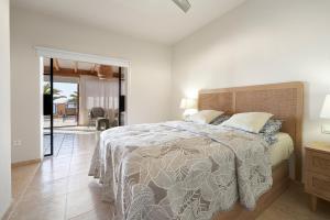 En eller flere senge i et værelse på Casa Alegria