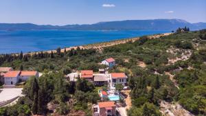 an aerial view of a house on a hill next to the water at Villa Tea - Kremena by Villas Guide in Blace