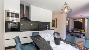 a kitchen and living room with a table and chairs at Villa Tea - Kremena by Villas Guide in Blace