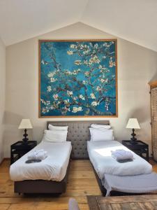 Ένα ή περισσότερα κρεβάτια σε δωμάτιο στο Maison d'Hôtes Les Variétés