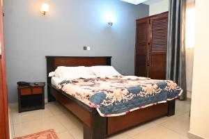 Ένα ή περισσότερα κρεβάτια σε δωμάτιο στο Hôtel Santa Lucia