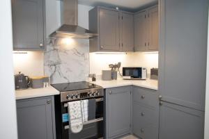 Η κουζίνα ή μικρή κουζίνα στο Dolphin View New Quay