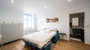 Ένα ή περισσότερα κρεβάτια σε δωμάτιο στο Le Manon 2