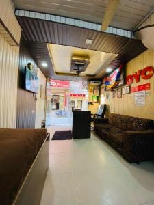 a lobby of a fast food restaurant with couches at RS Hotel in Amritsar +6 photos