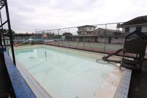 an empty swimming pool with a playground at Villa Gunung By ARBA in Pasakon 1