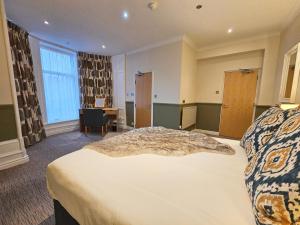 Ένα ή περισσότερα κρεβάτια σε δωμάτιο στο Derwent Manor Apartments