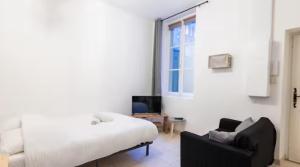 Postel nebo postele na pokoji v ubytování Le théâtre 2