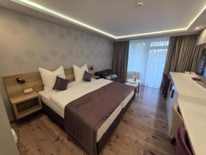Postel nebo postele na pokoji v ubytování TeMax Lux Hahnenklee