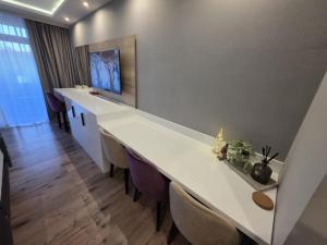 TV a/nebo společenská místnost v ubytování TeMax Lux Hahnenklee + 2 fotografie