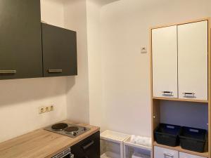 a kitchen with a stove and a cabinet at Apartment an der Dürerstraße in Nuremberg