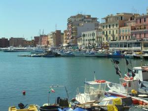 a group of boats docked in a harbor with buildings at LA LOGGETTA appartamento nel cuore di Anzio in Anzio