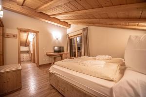 Postel nebo postele na pokoji v ubytování Chalet Larice