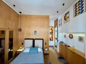 En eller flere senge i et værelse på Loft art-déco centre-ville Casa