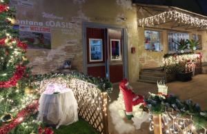 a house decorated for christmas with a christmas tree and lights at Castelnuovo Workx in Castelnuovo