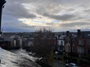 a view of a city from the roof of a building at The Bluebird B&B I in Headingley